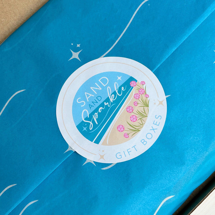 New Mum Lettebox Gift - Wrapping paper pictured with coastal sticker