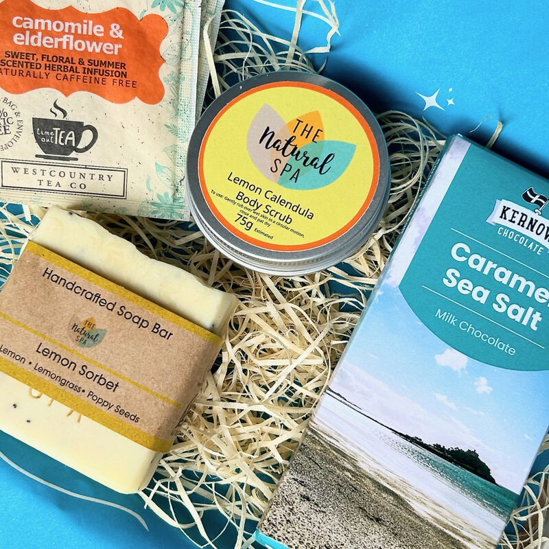 Letterbox Pamper Gift Set from Sand and Sparkle - packed with Devon and Cornish artisan products including lemon calendula body scrub, handmade lemon sorbet soap, Kernow Chocolate and enveloped tea bags.