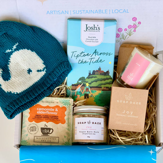 Mother and Baby Gift Set with Eco friendly with merino wool baby beanie made in Cornwall, artisan Cornish chocolate, a 'Joy' candle and bath salts made in Devon and Chamomile tea bags