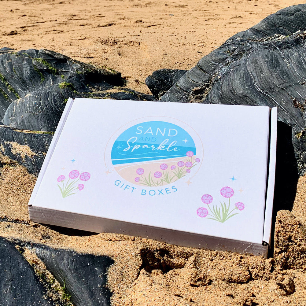 New Mum Letterbox Gift Set pictured on Cornish beach
